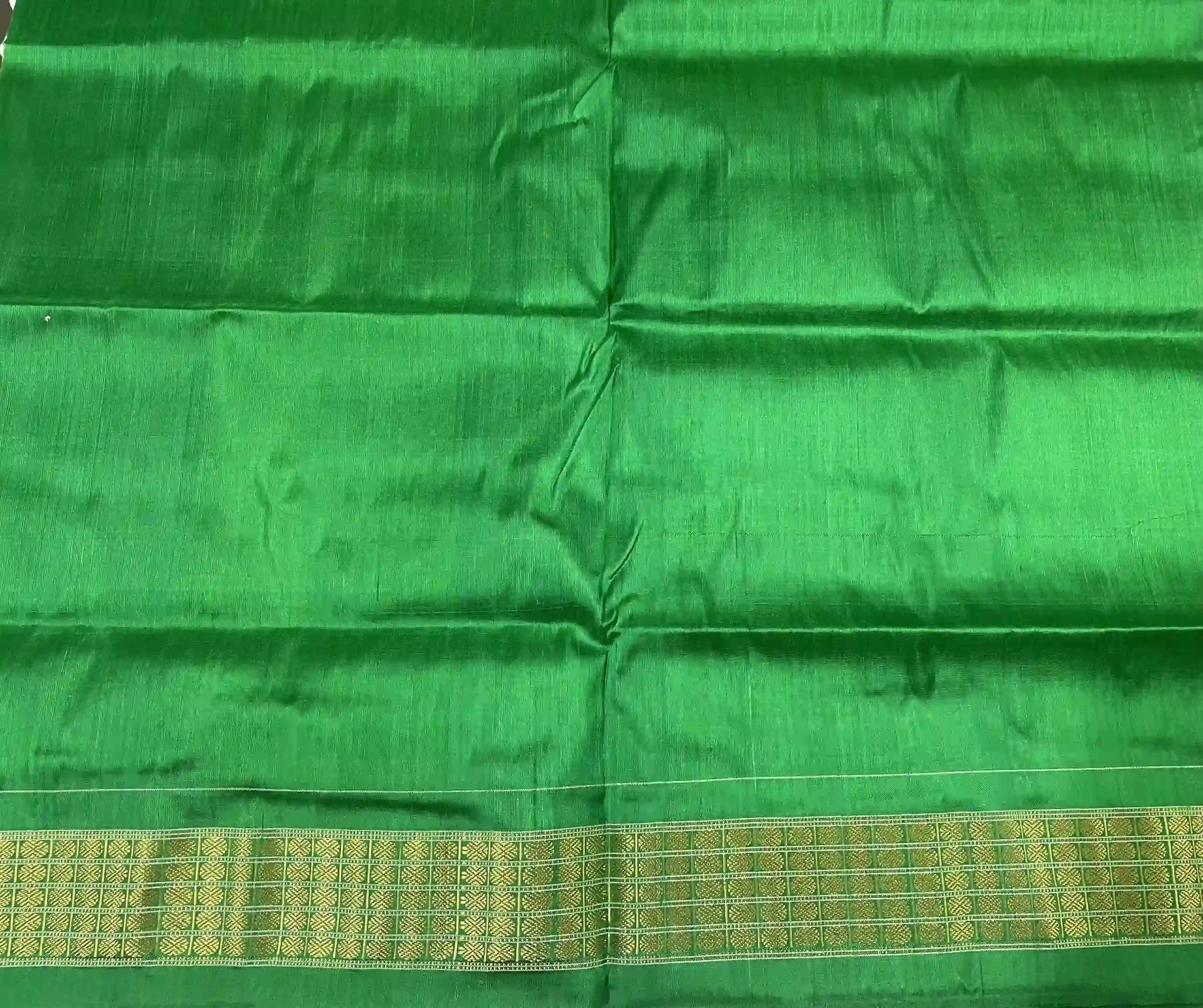 Plain green color blouse piece to go with the saree